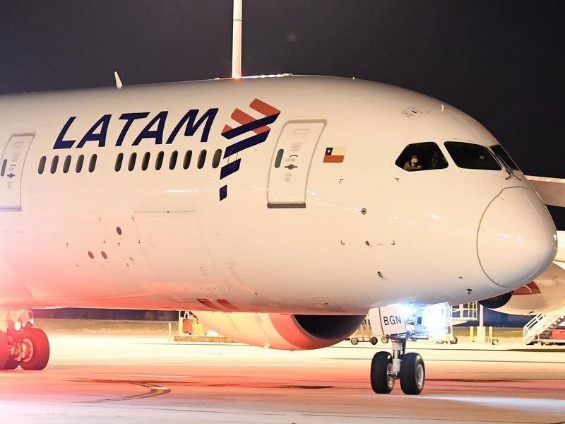 A plane traveling from New Zealand to Australia experiences an in-flight emergency at Auckland Airport, resulting in more than 50 injuries