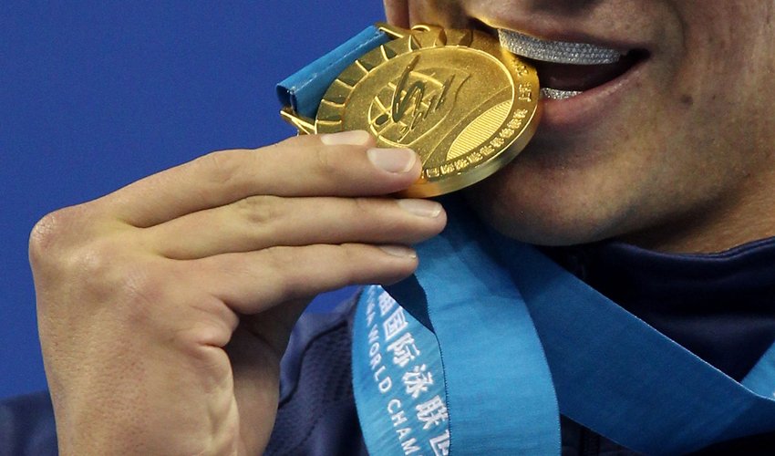 Why do Olympians bite their medals? Here’s the tradition behind the habit