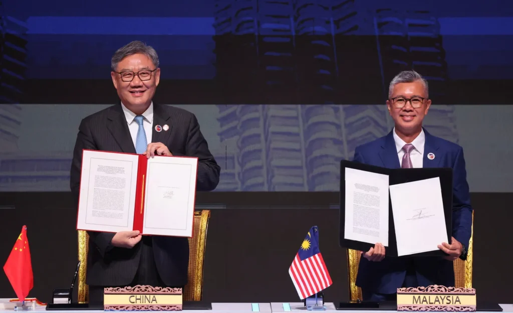 ASEAN and China enhance free trade pact, boosting cooperation in digital and green sectors amid US tariff pressures.