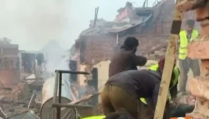18 people die in a Faisalabad factory explosion as rescue teams search debris and damaged homes for survivors.